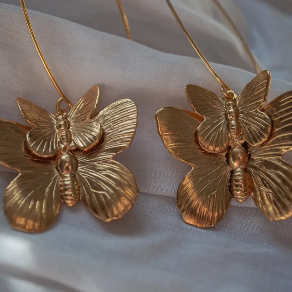 Lotta Djossou Boucles d'oreilles Double Papillon Dorées New